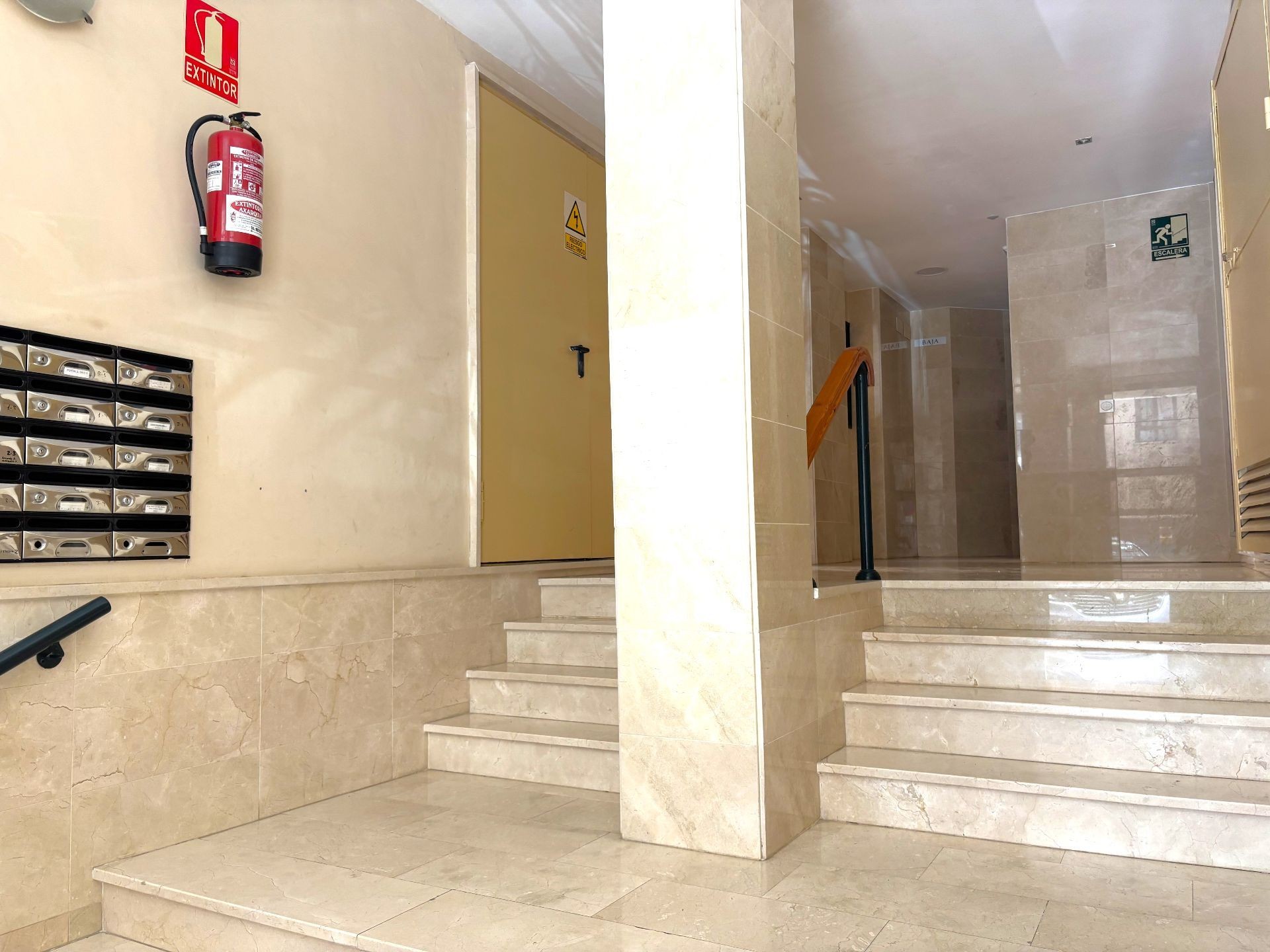 Entrance lobby with stairs and mailboxes