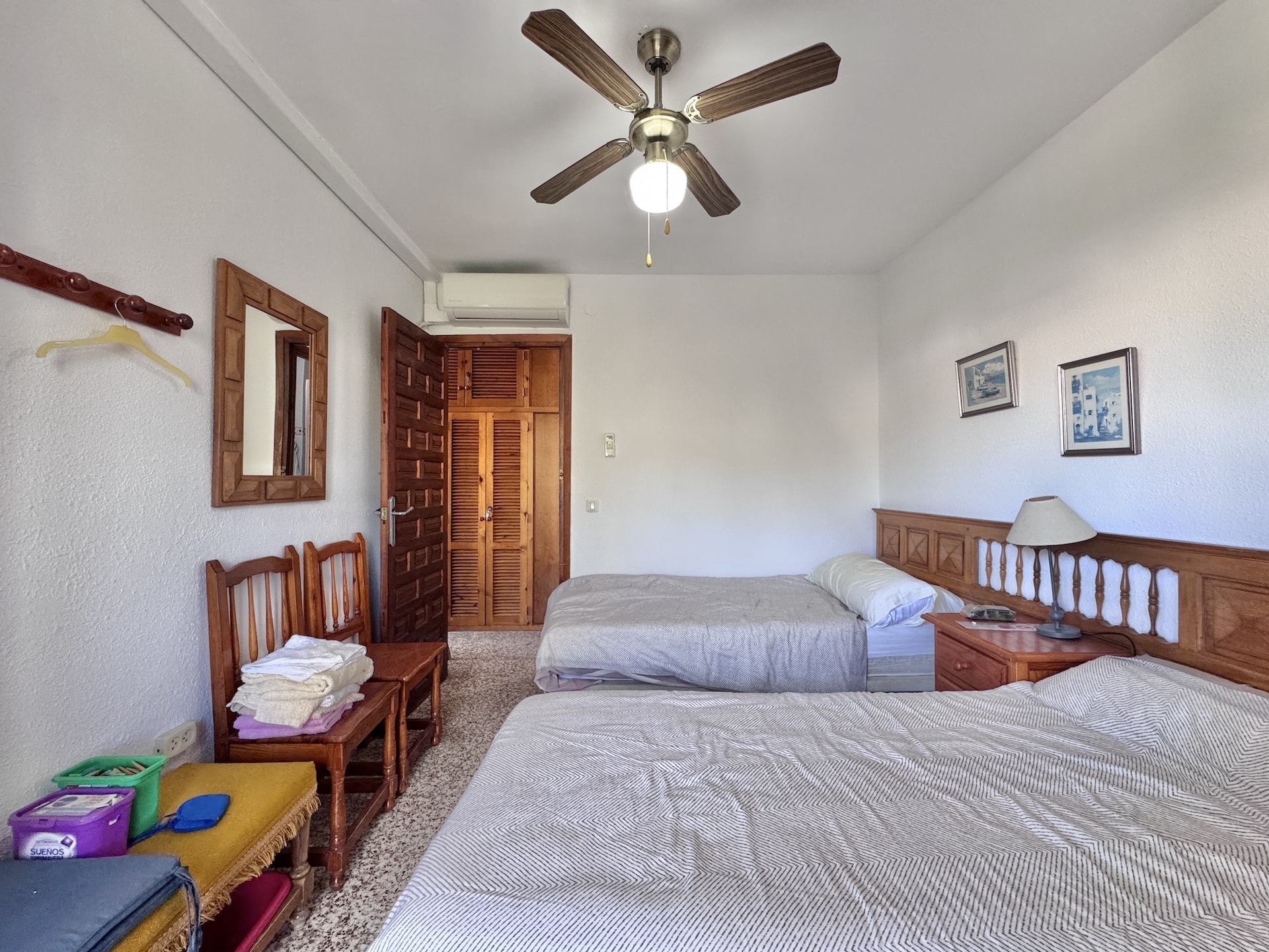 Bedroom with two single beds and wardrobe