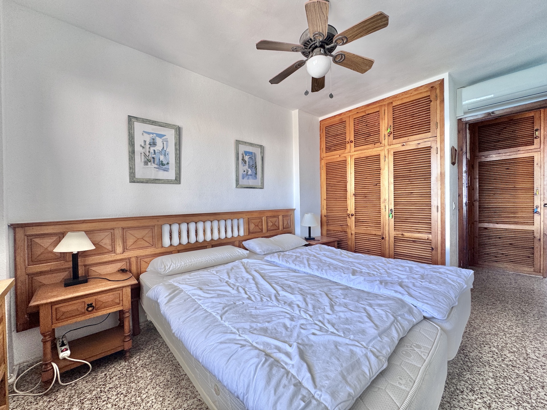 Main bedroom with double bed and wardrobes