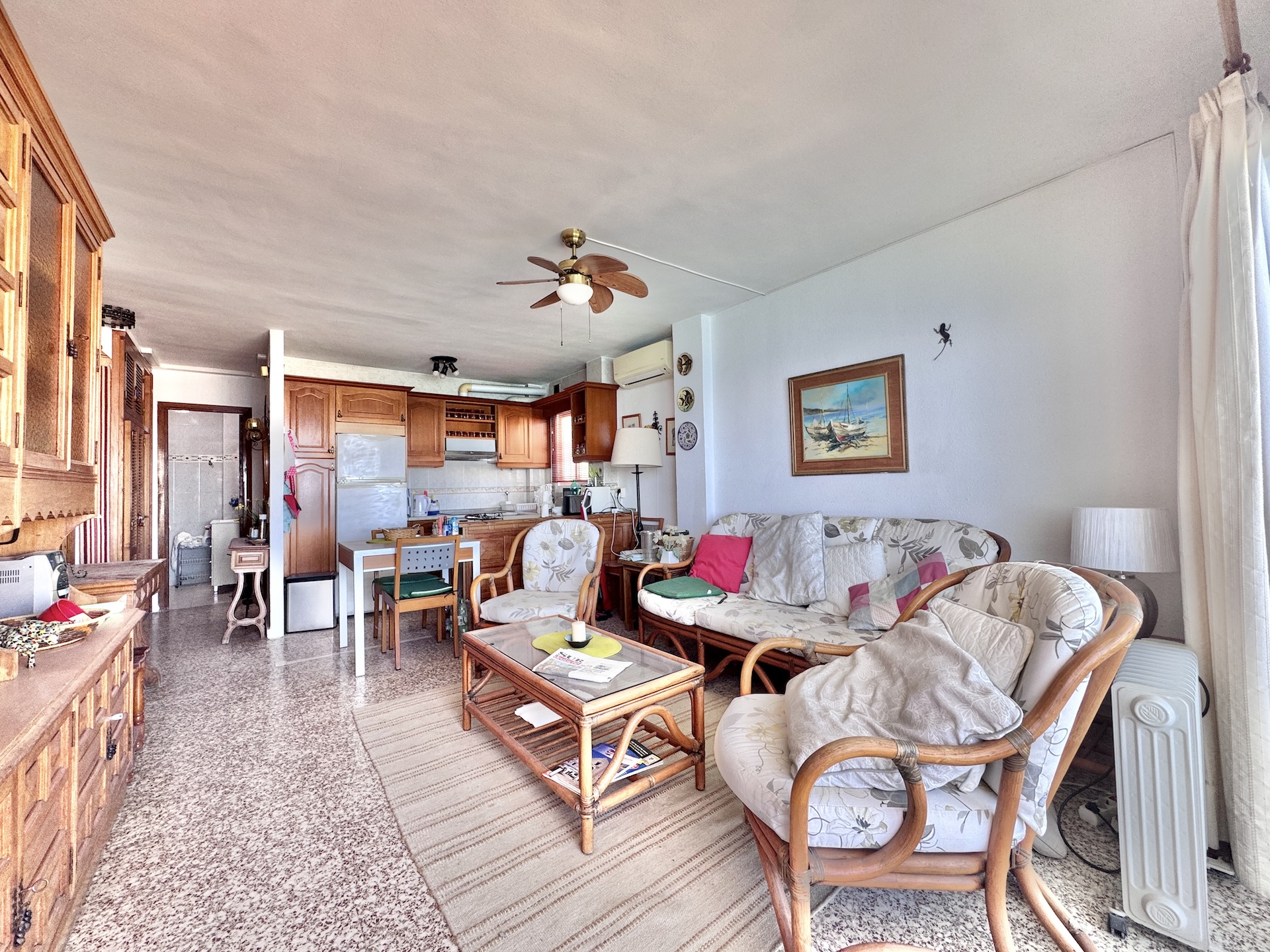Living room with open kitchen and side views