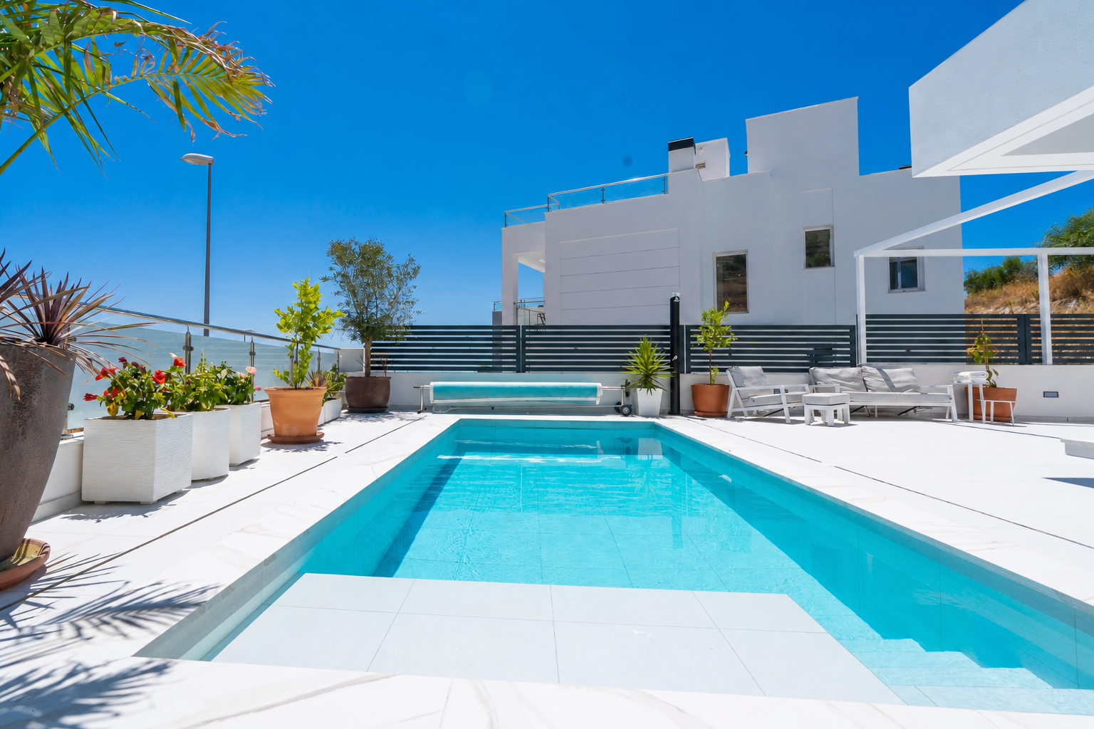 Outdoor terrace with pool and lounge area
