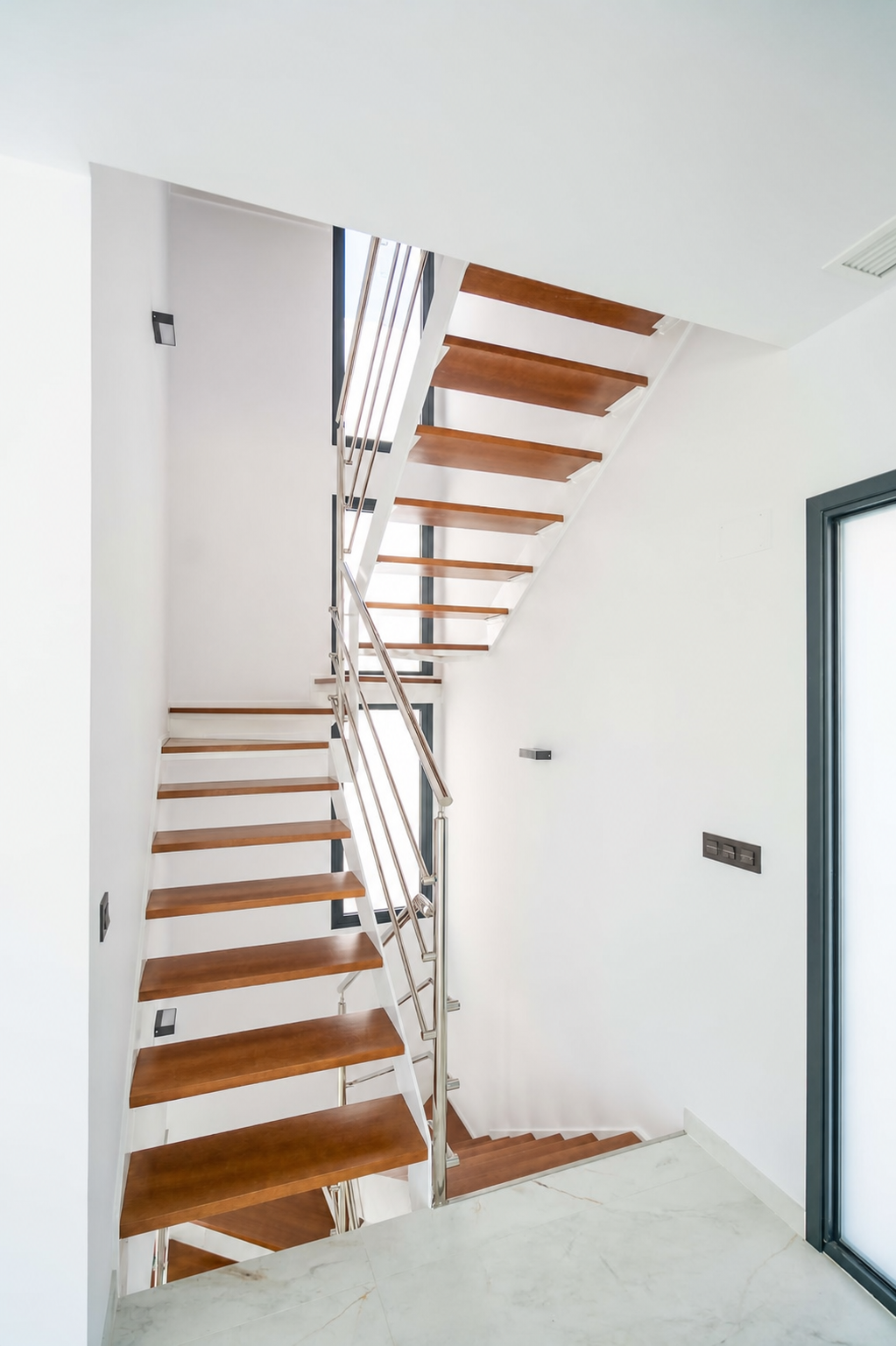 Modern interior staircase with wooden steps