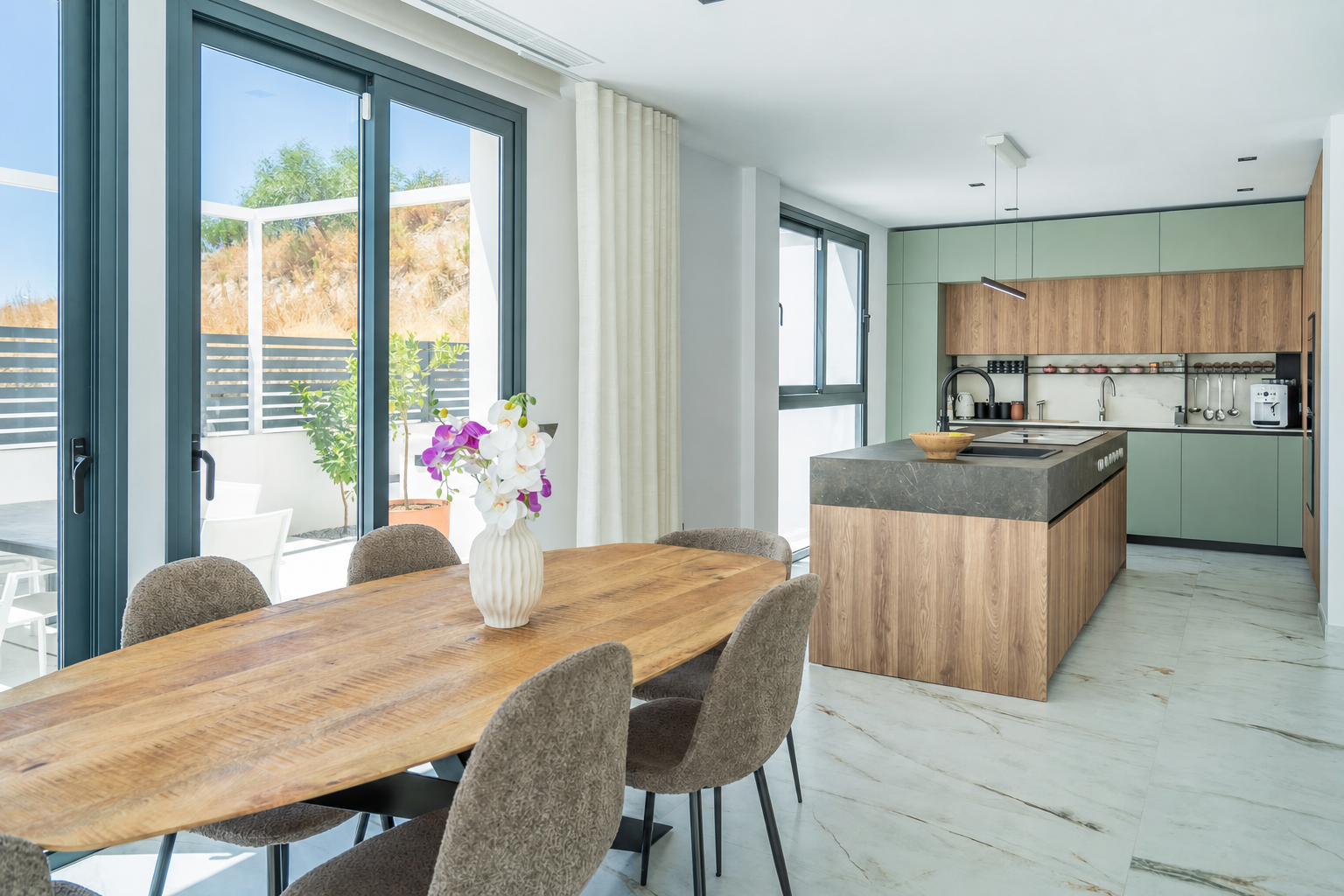 Dining area with wooden table next to kitchen