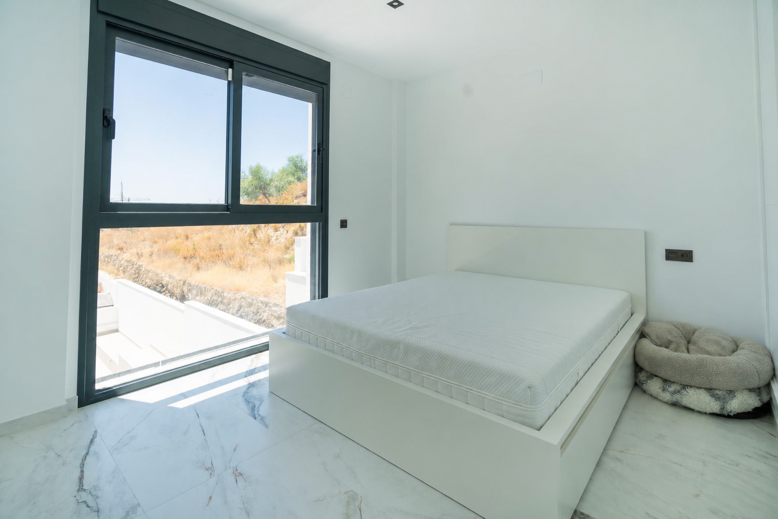 Bedroom with double bed and terrace access