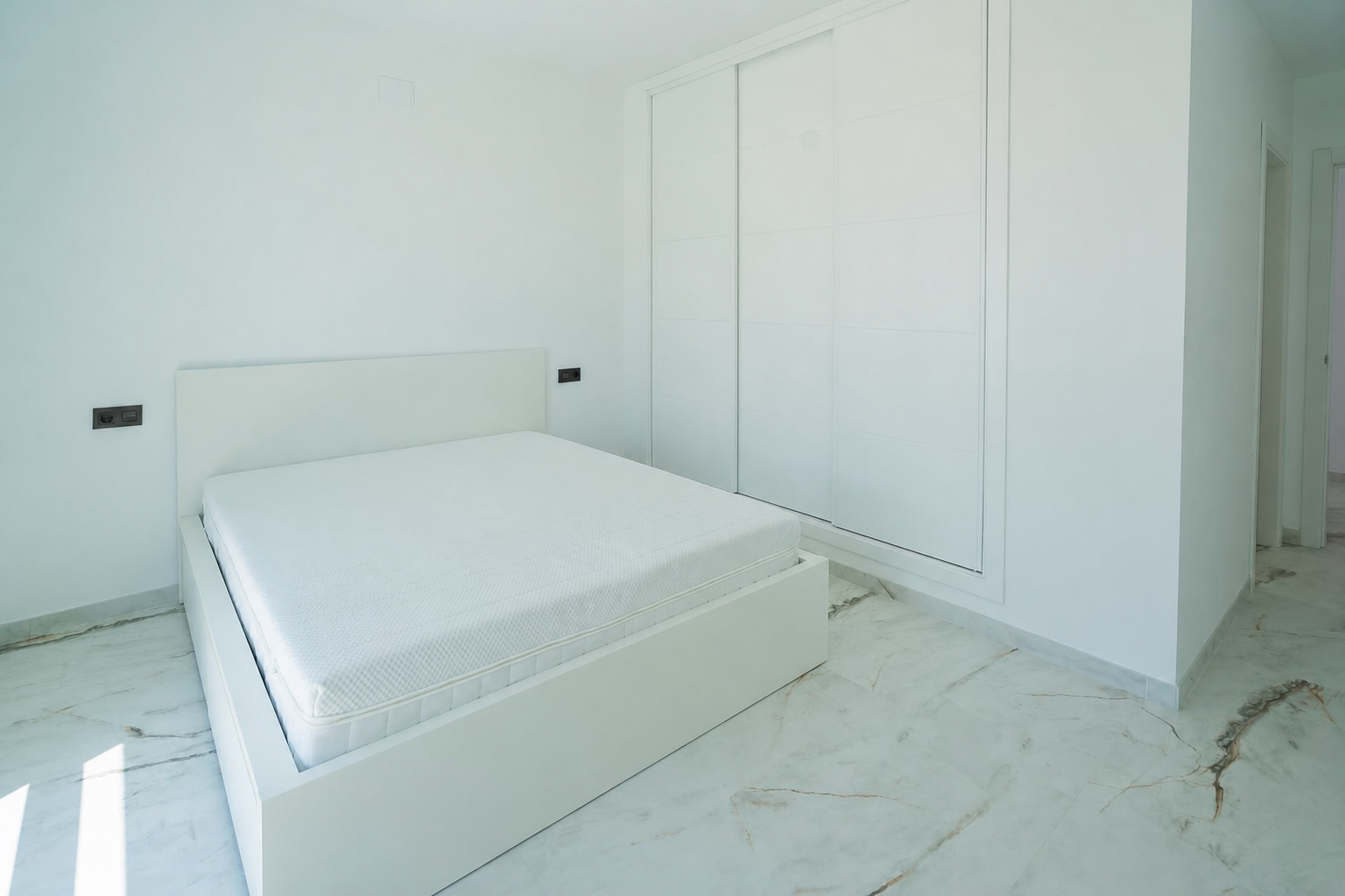 Bedroom with double bed and built-in wardrobe