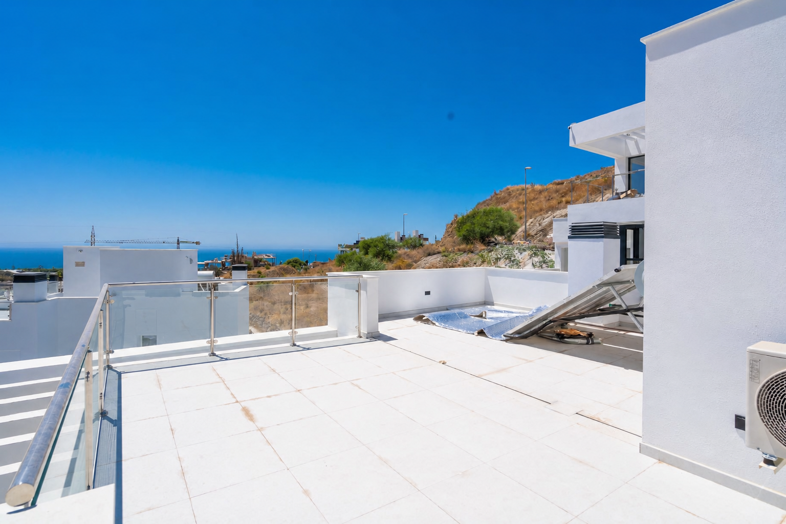 Large rooftop with sun deck and open views