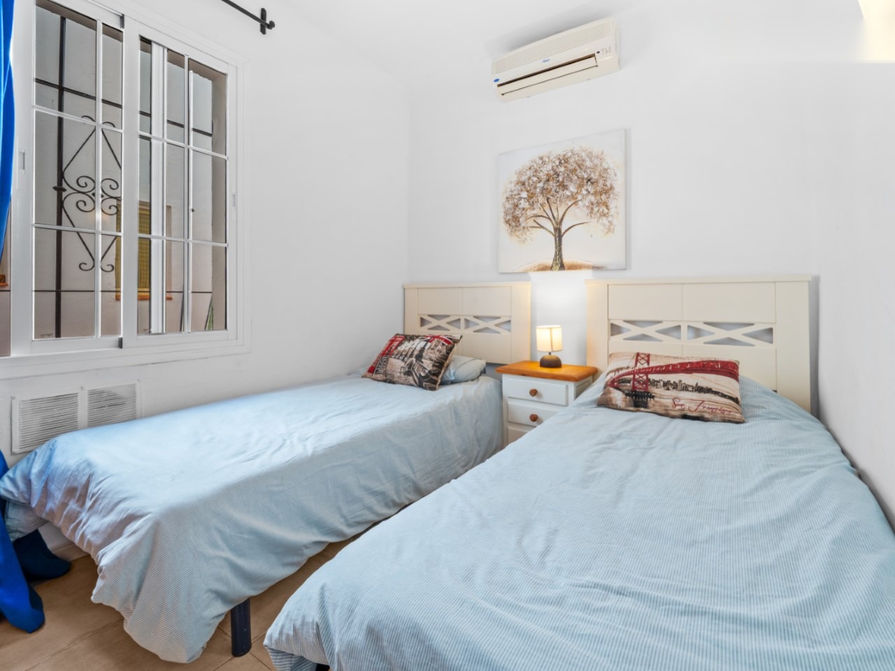Bedroom with two single beds and simple decor