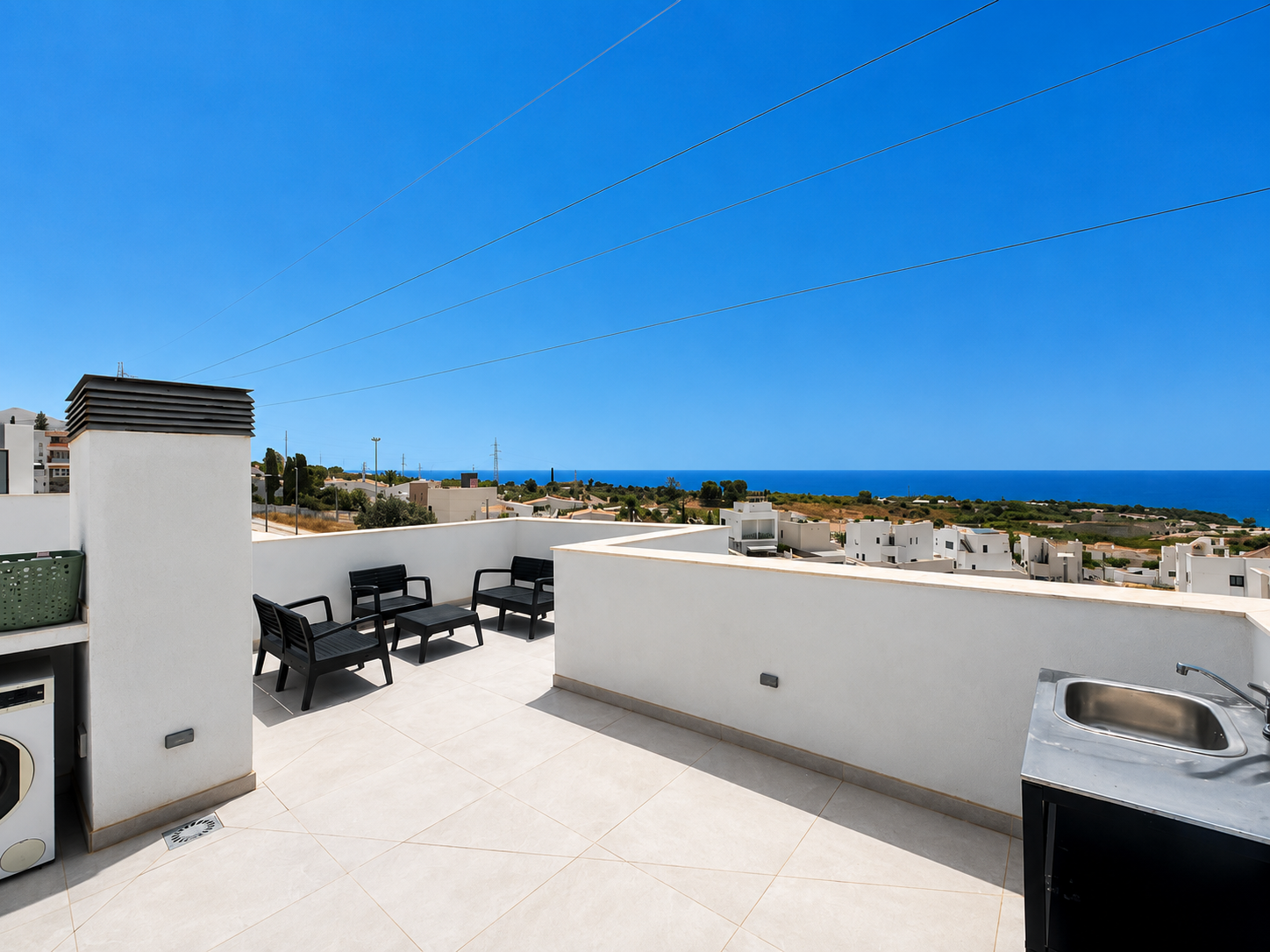 Upper terrace with sea views and sink