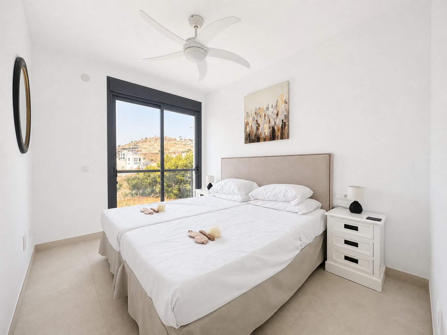 Bright twin bedroom with landscape views