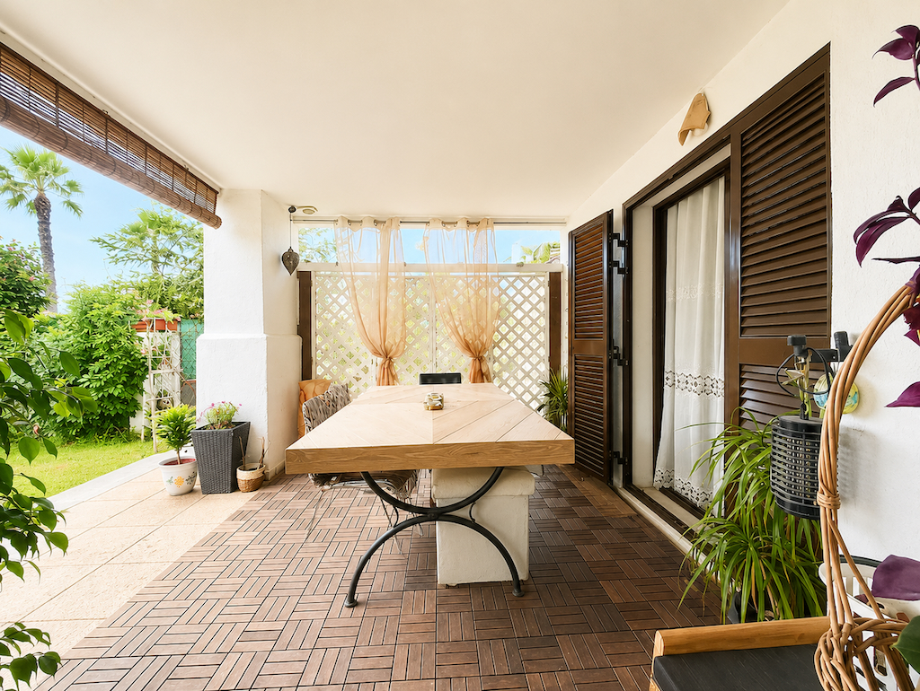 Covered terrace with outdoor dining table