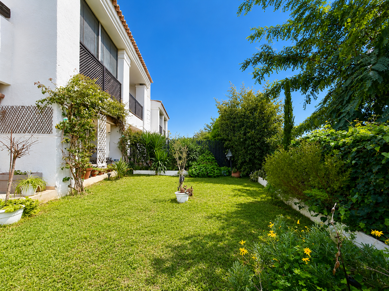 Private garden with lawn and lush greenery