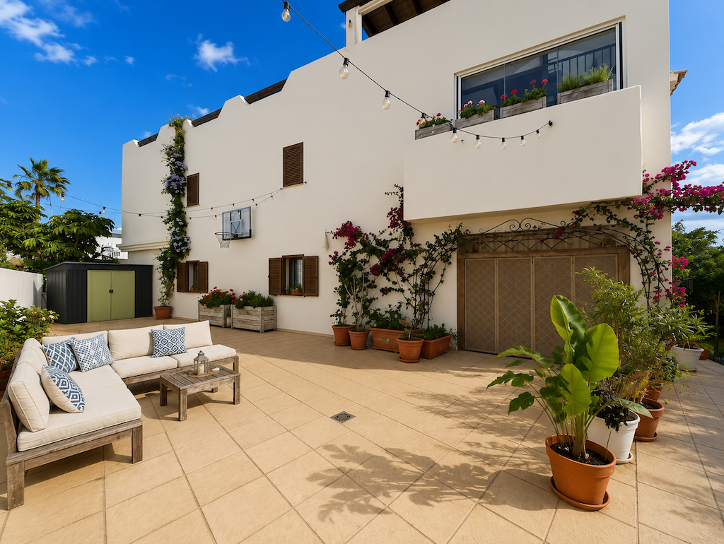 Exterior facade with paved courtyard and greenery