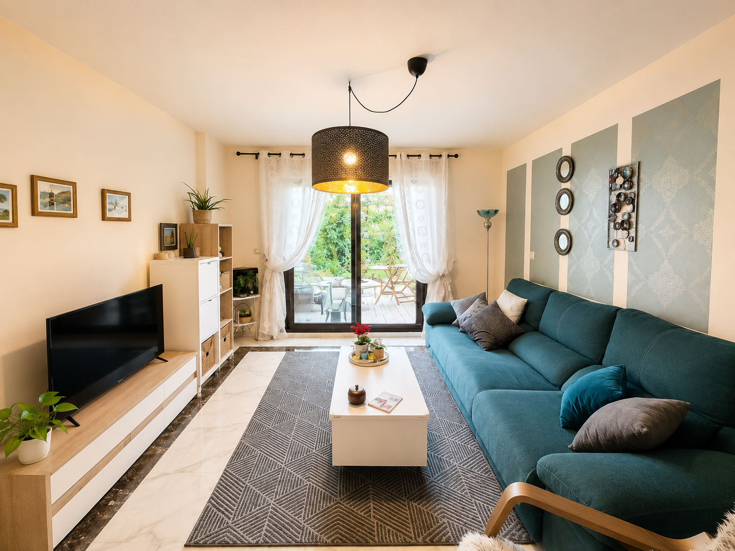 Bright living room with sofa and terrace access