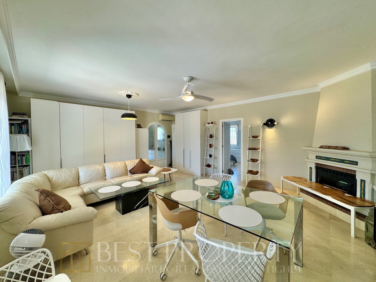 Bright living room with corner sofa and fireplace