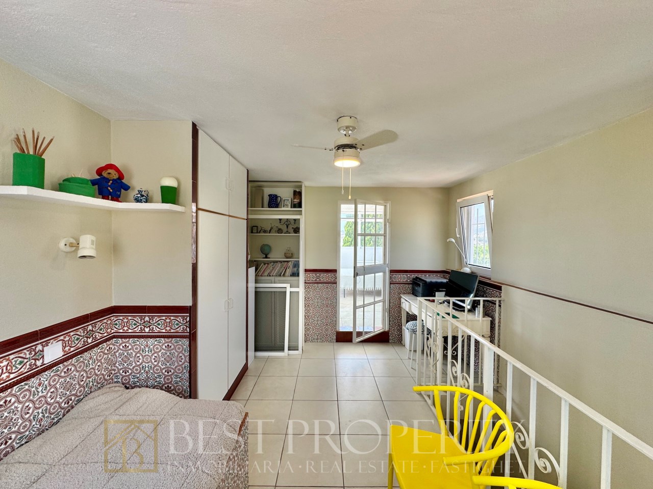 Landing with staircase, desk and storage cabinet