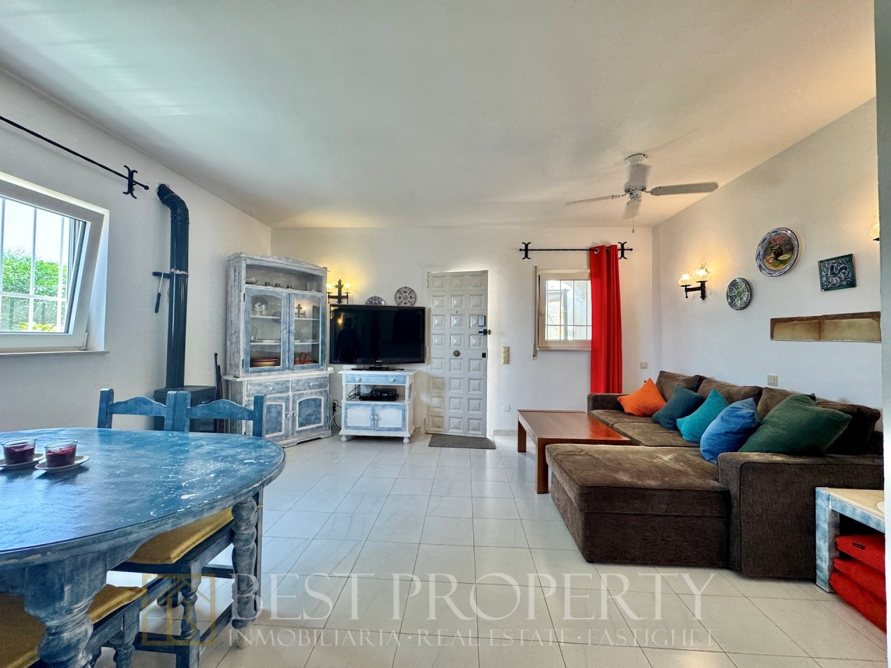 Living area with corner sofa and television