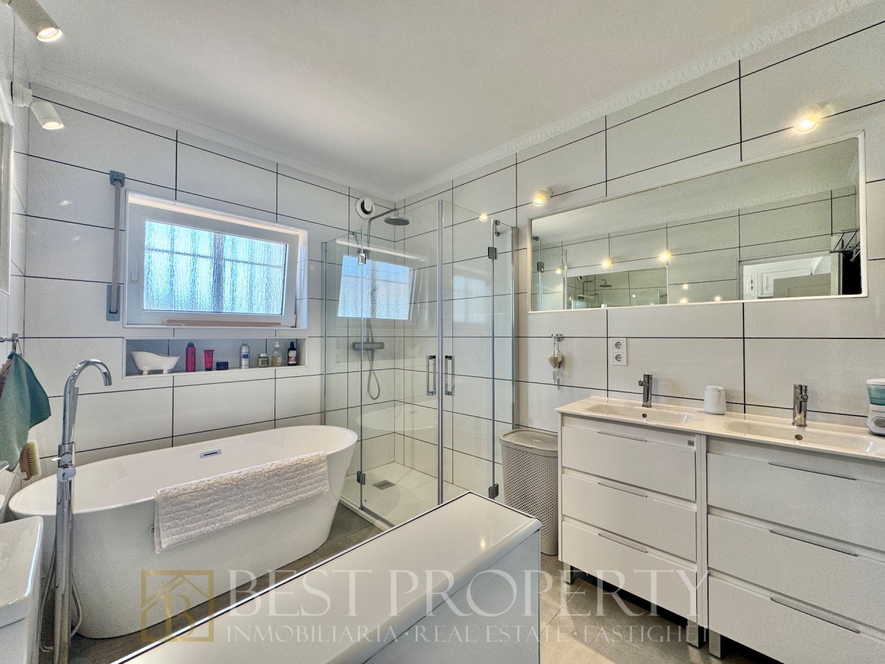 Modern bathroom with freestanding tub and glass shower