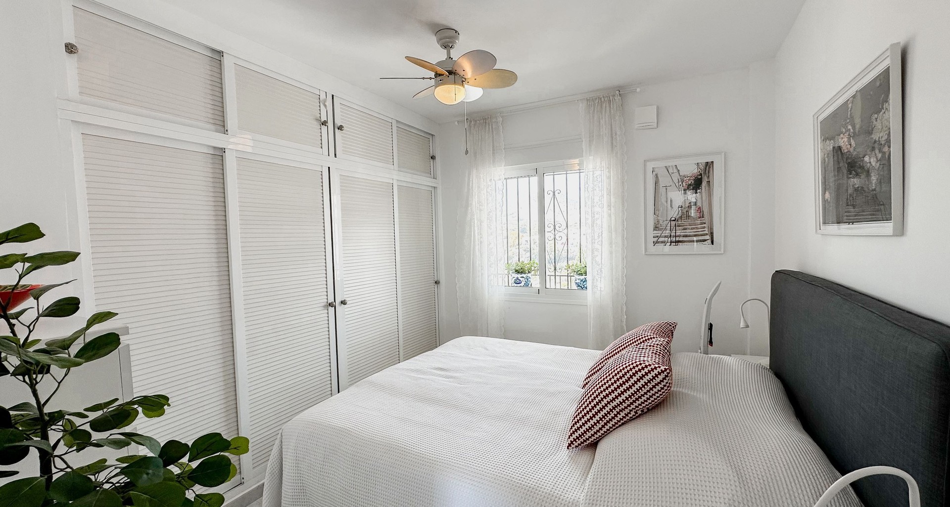 Bright master bedroom with fitted wardrobe