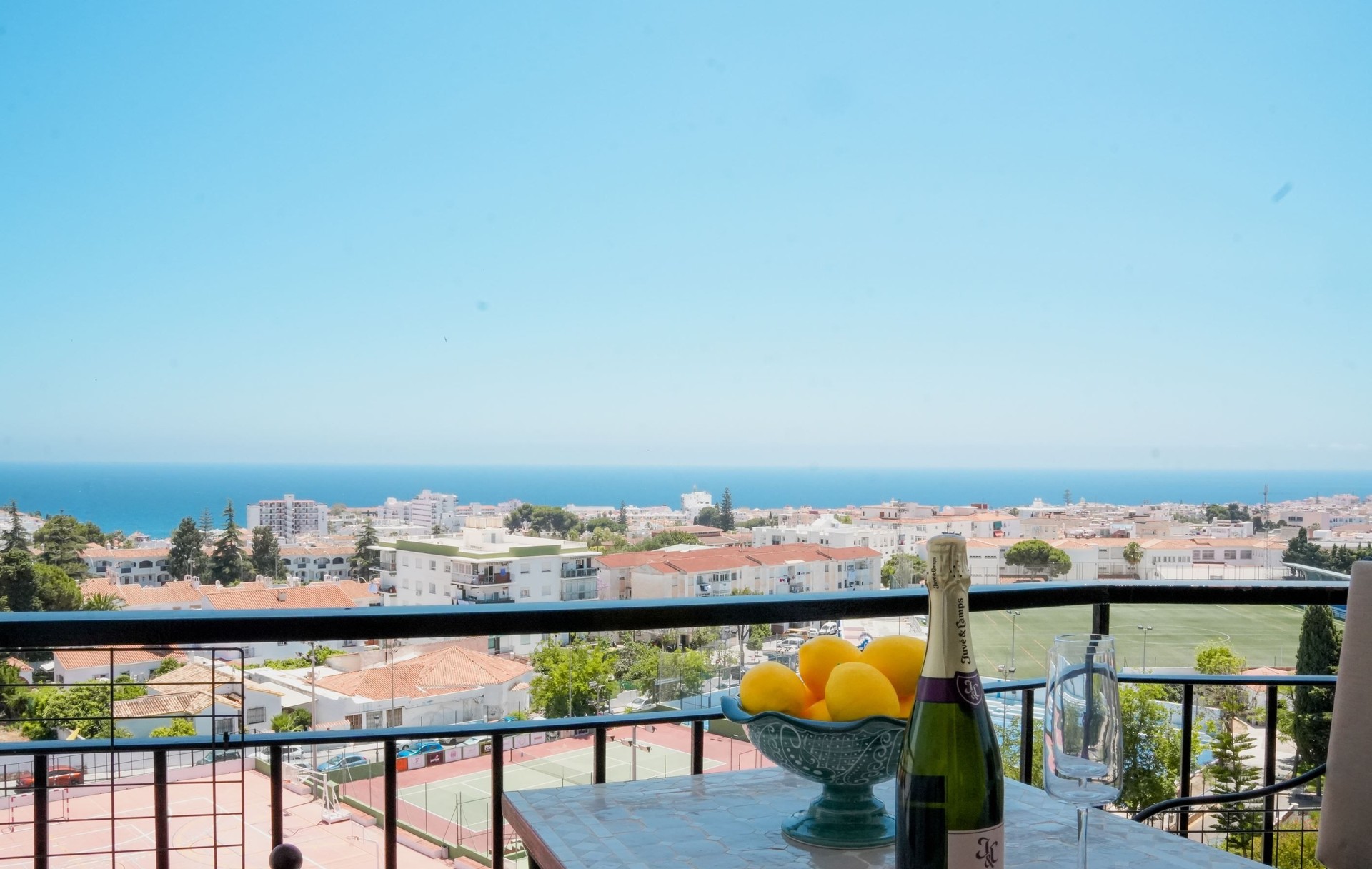 Terrace with table, fruit and sea views