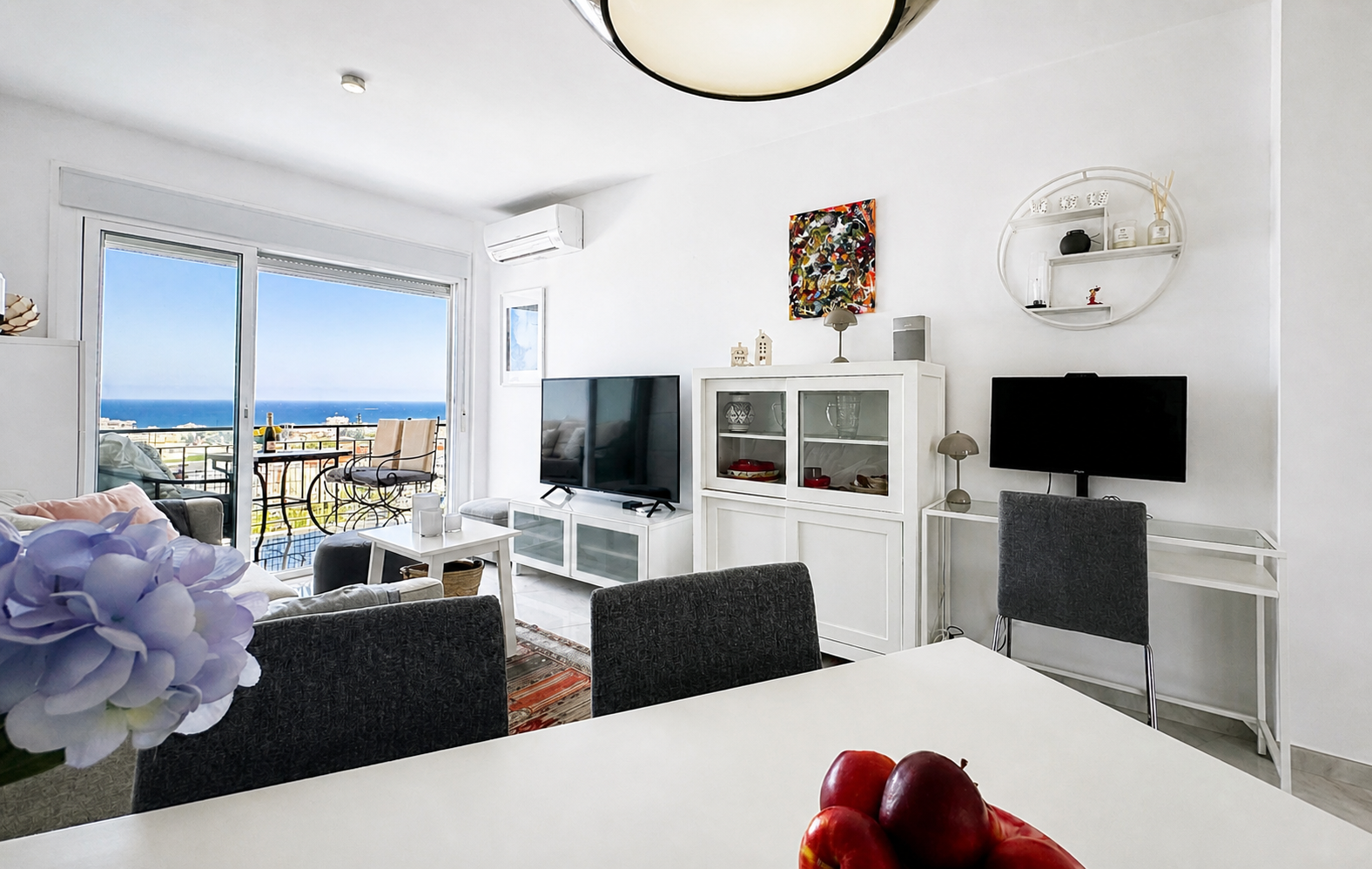 Living room with terrace access and sea views