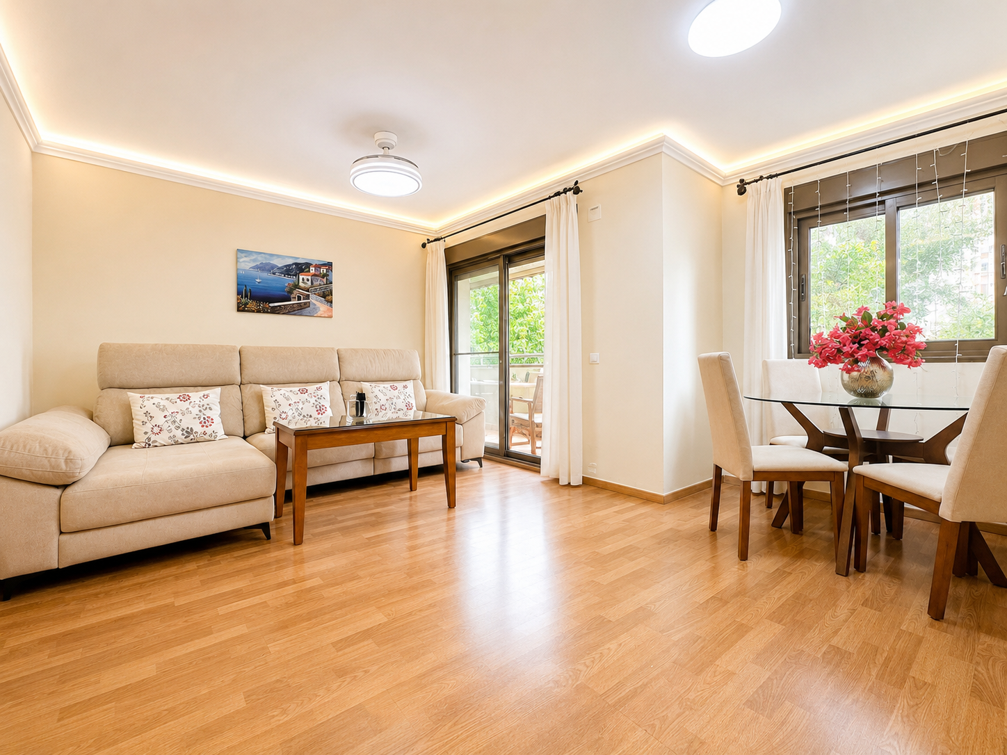 Living room with sofa, side table and terrace access