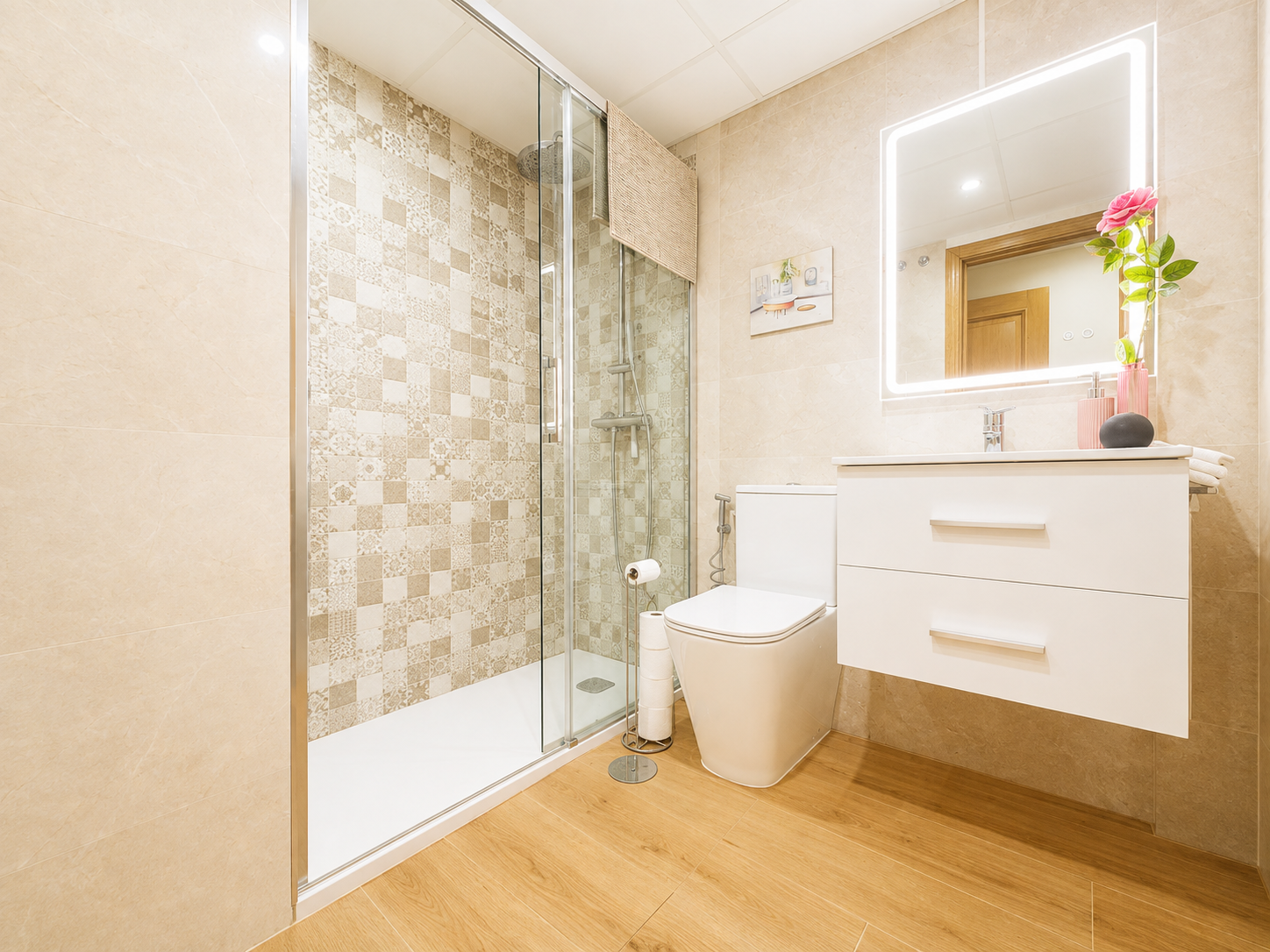 Bathroom with shower, toilet and vanity unit