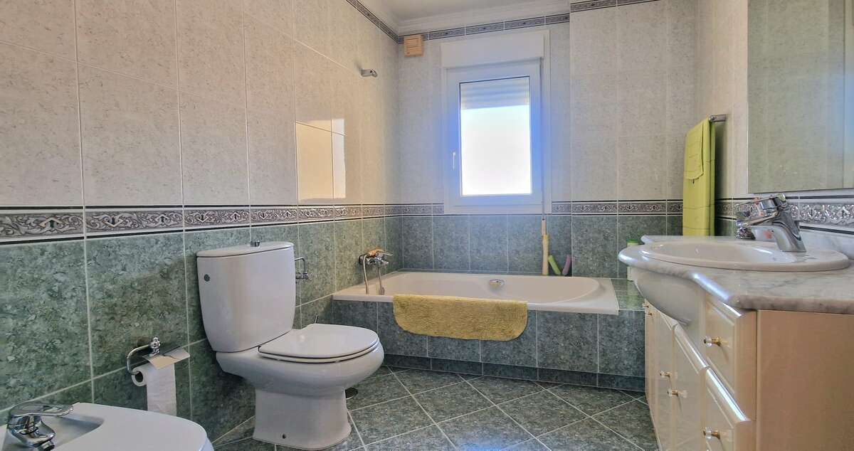 Full bathroom with bathtub and sink