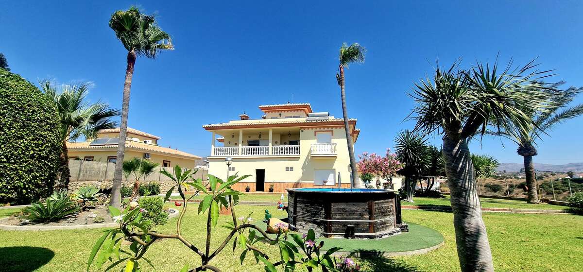 Main garden with pool and palms