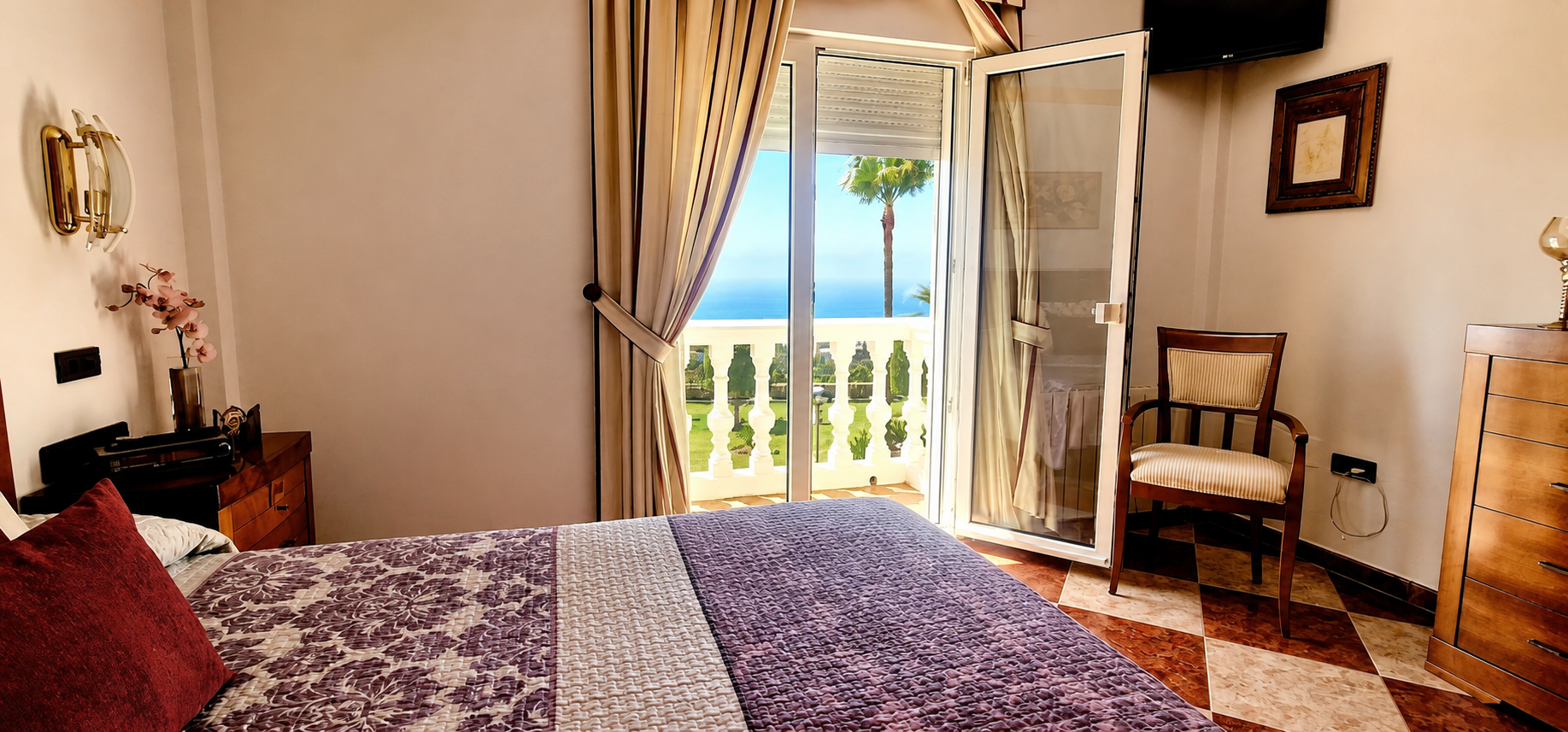 Main bedroom with balcony and sea views