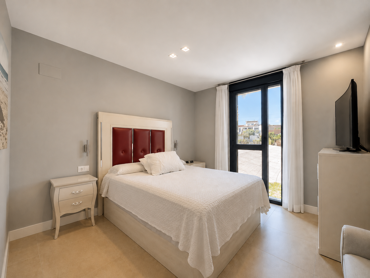Main bedroom with double bed and outdoor access