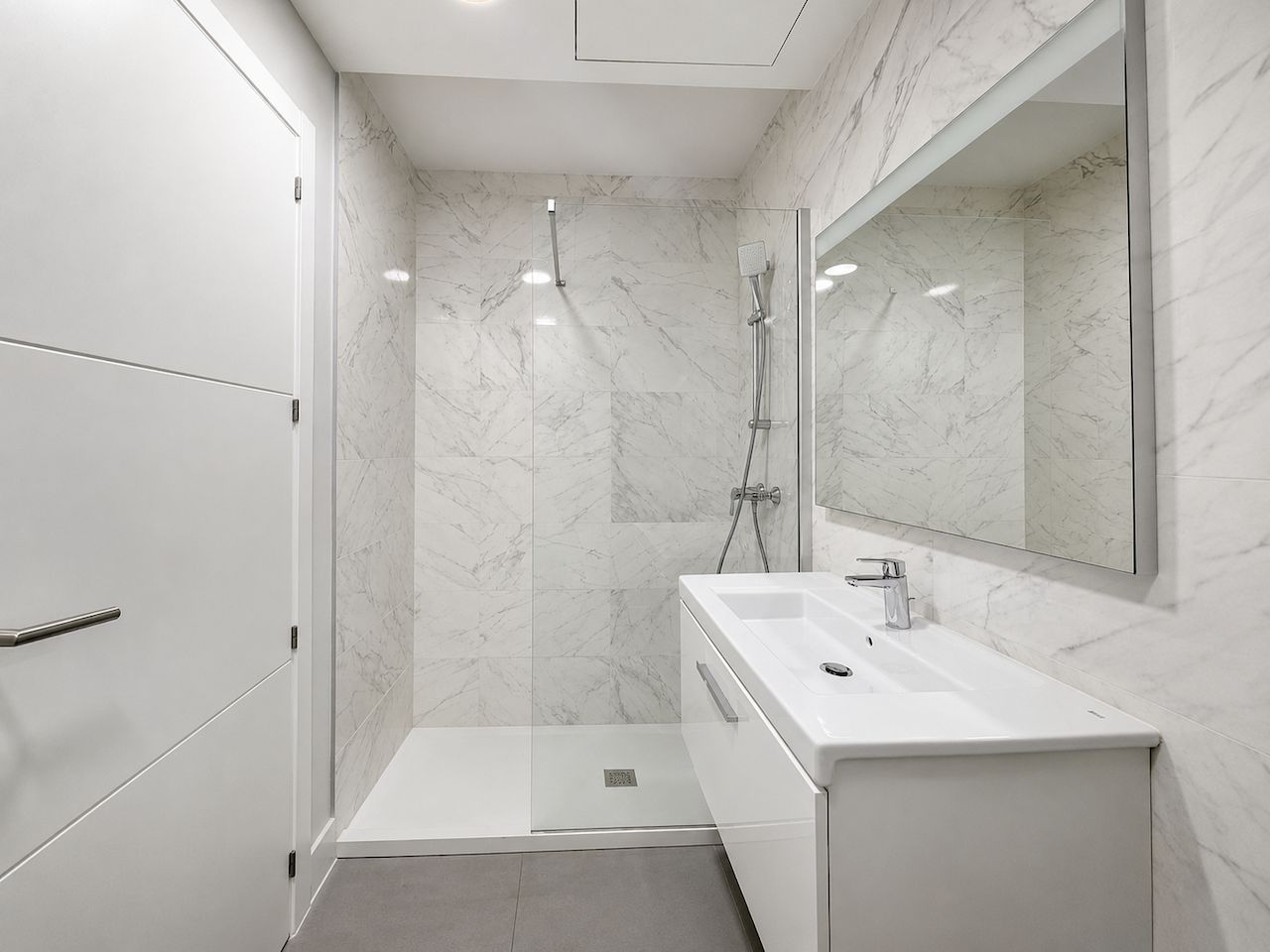 Modern bathroom with shower and minimalist sink