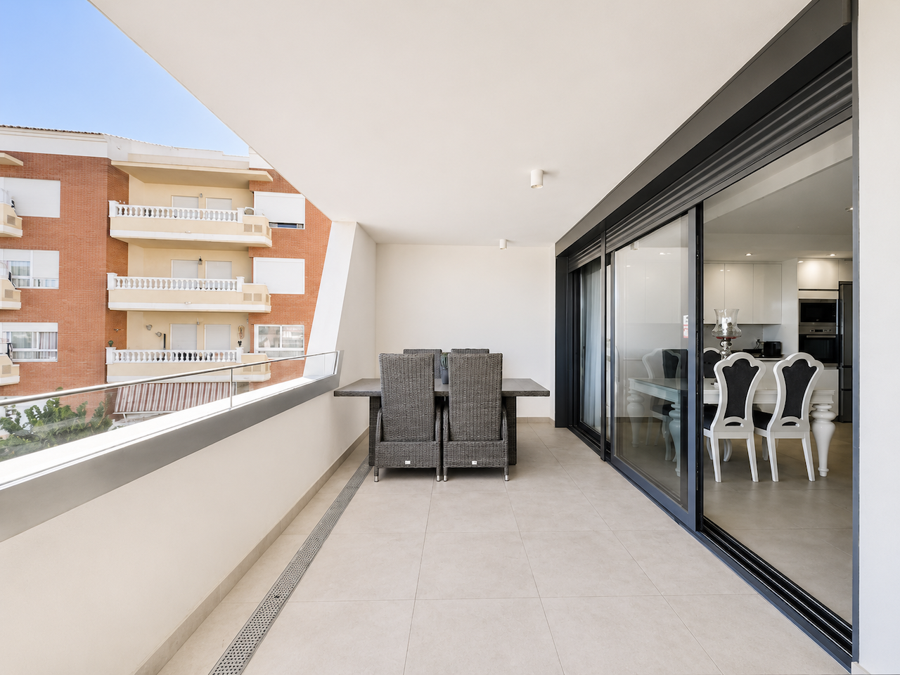 Spacious terrace with outdoor table beside the dining area