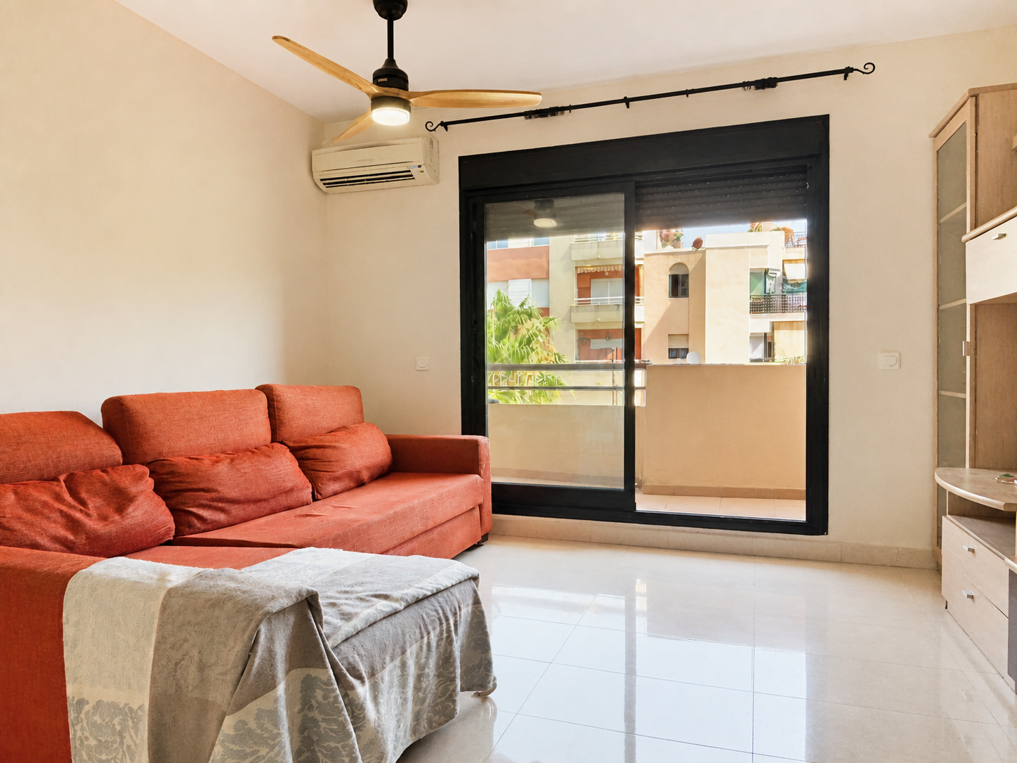Living room with sofa and terrace access