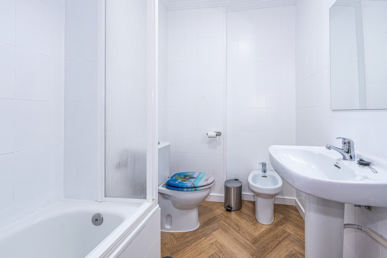 Full bathroom with bathtub, sink and bidet