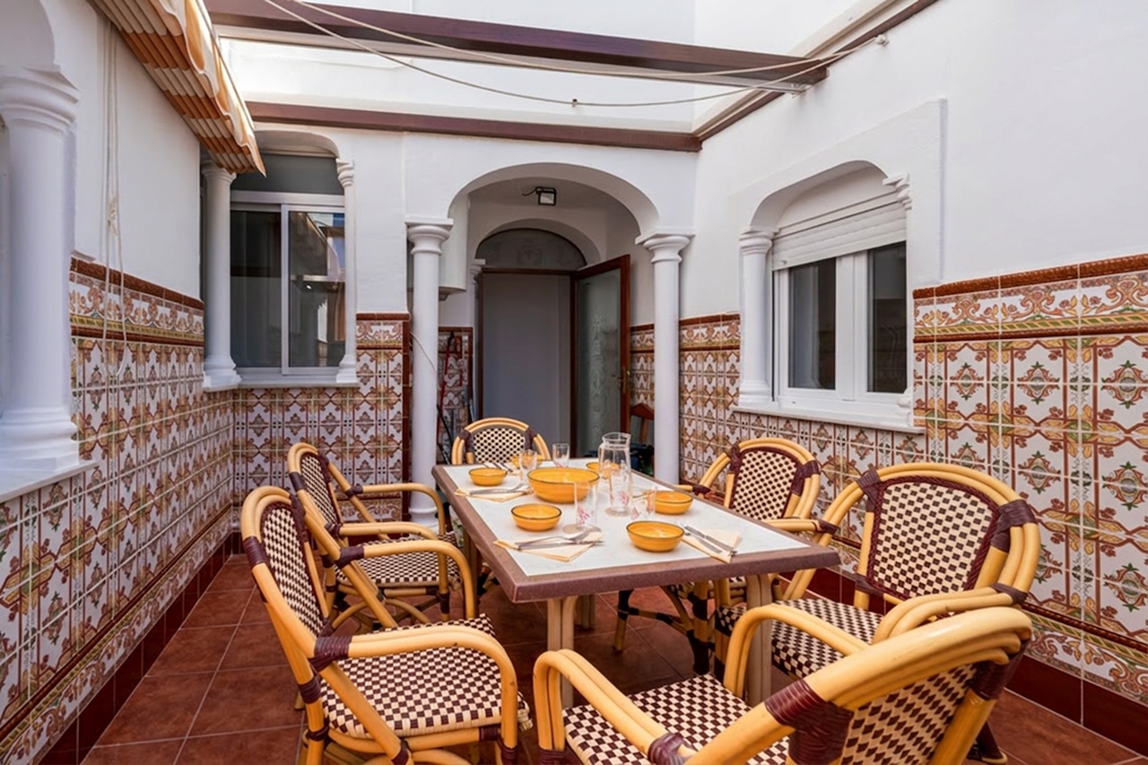 Spacious covered terrace with outdoor dining table