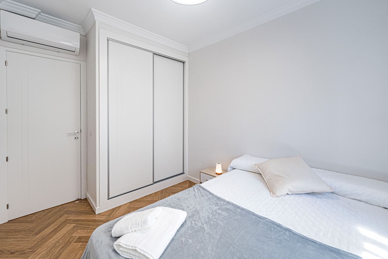 Bedroom with built-in wardrobe and double bed