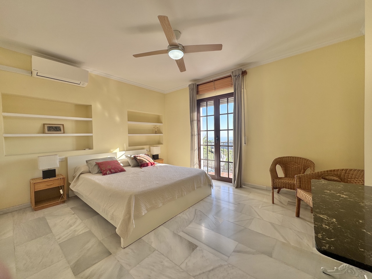 Bright principal bedroom with views and balcony access