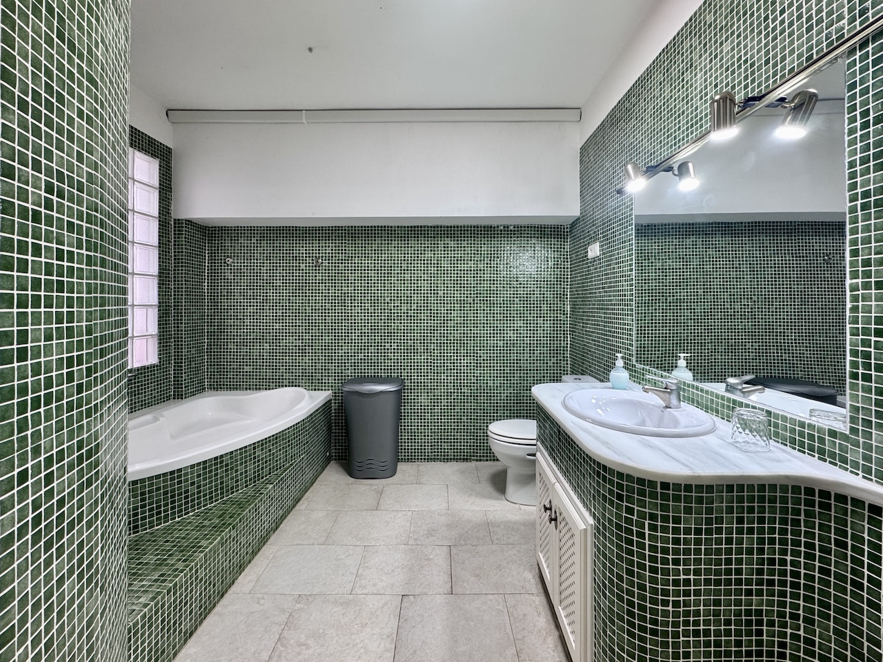 Main bathroom with bathtub and sink