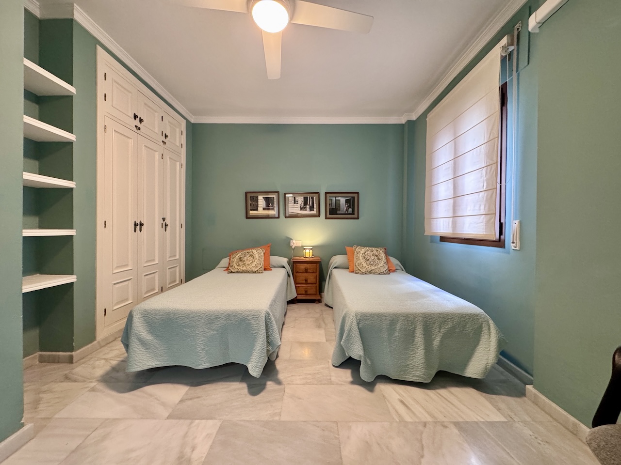 Bedroom with two single beds and wardrobe