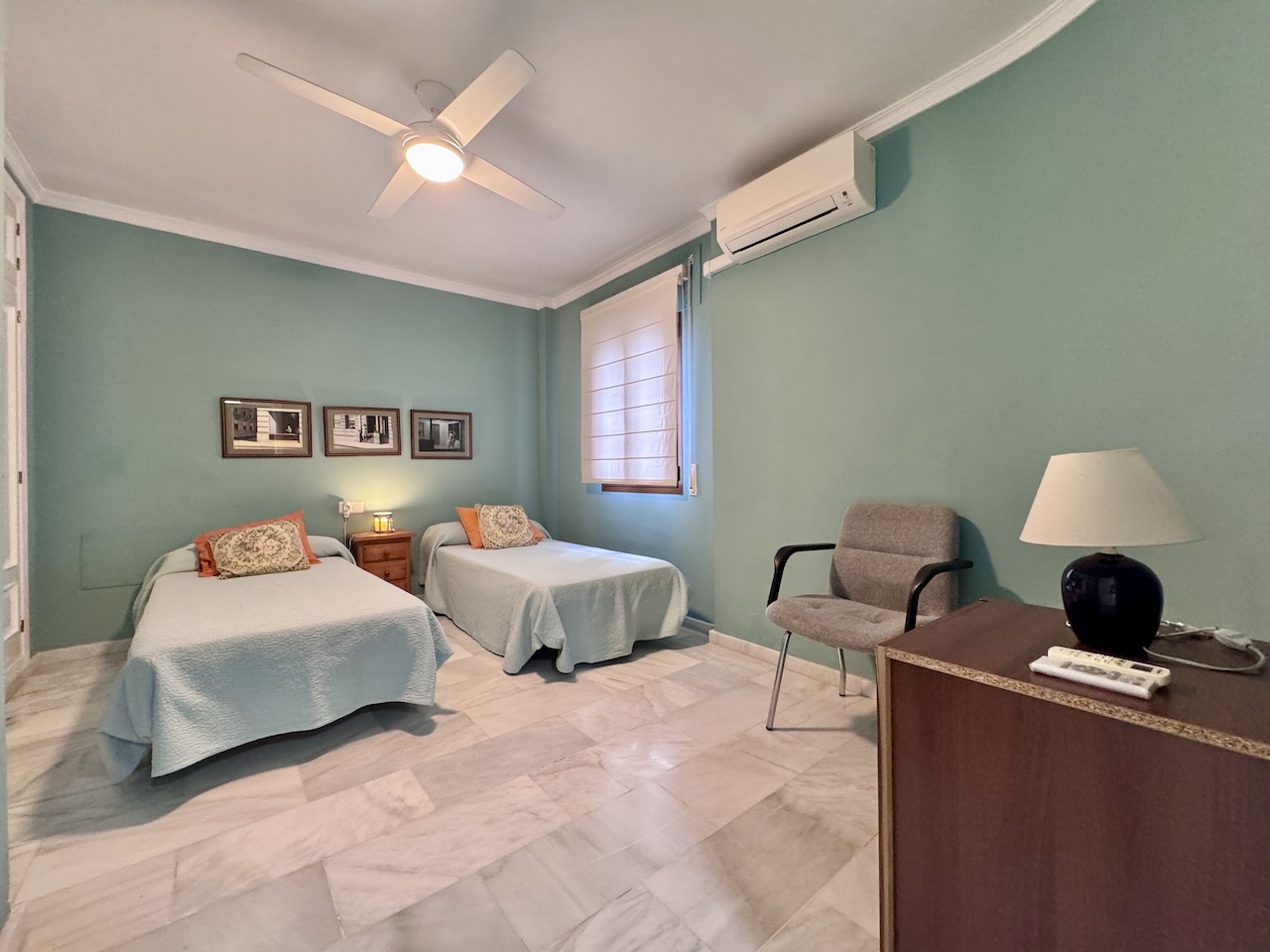 Bedroom with two single beds and window