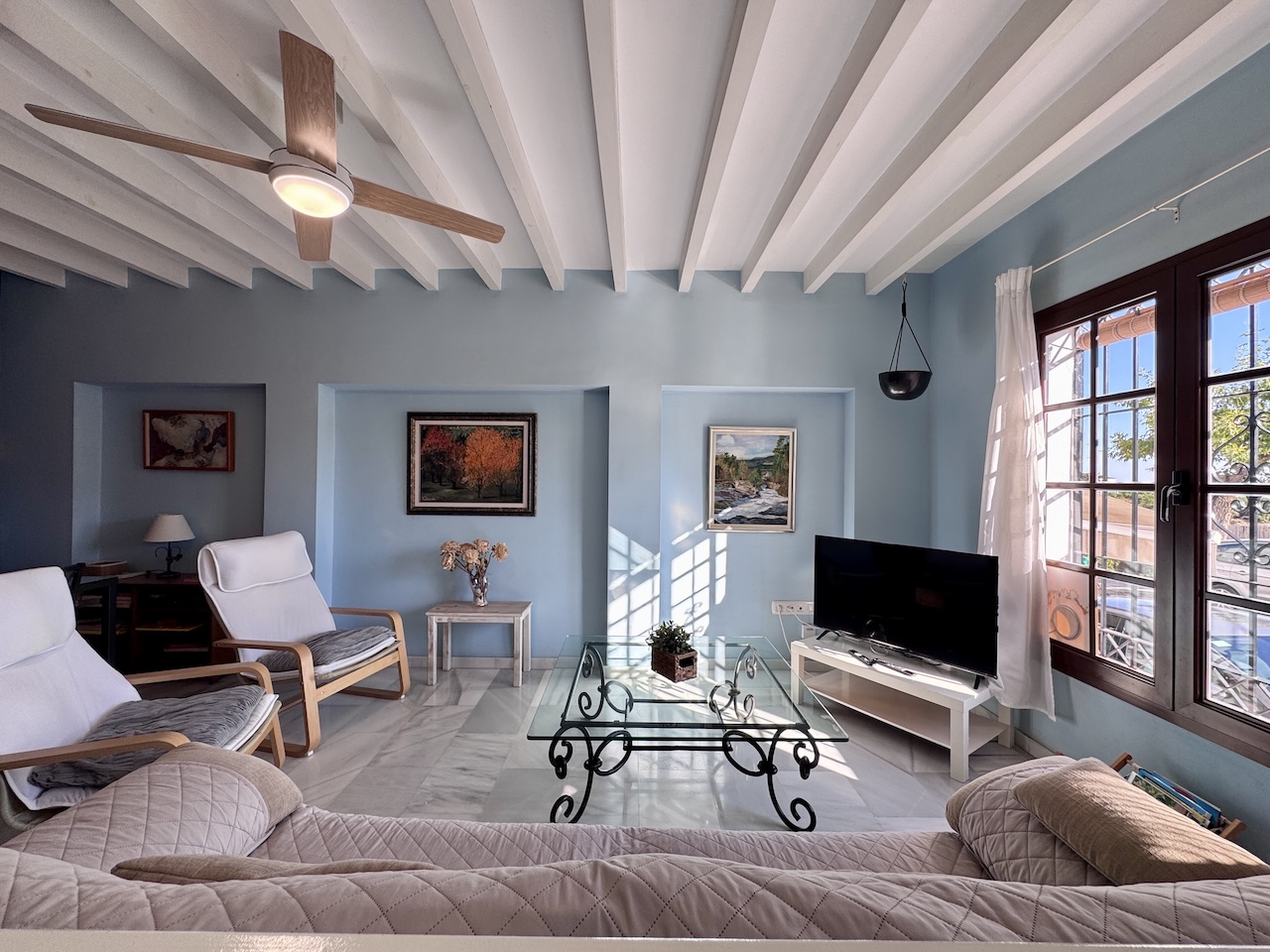 Living room with windows and terrace access