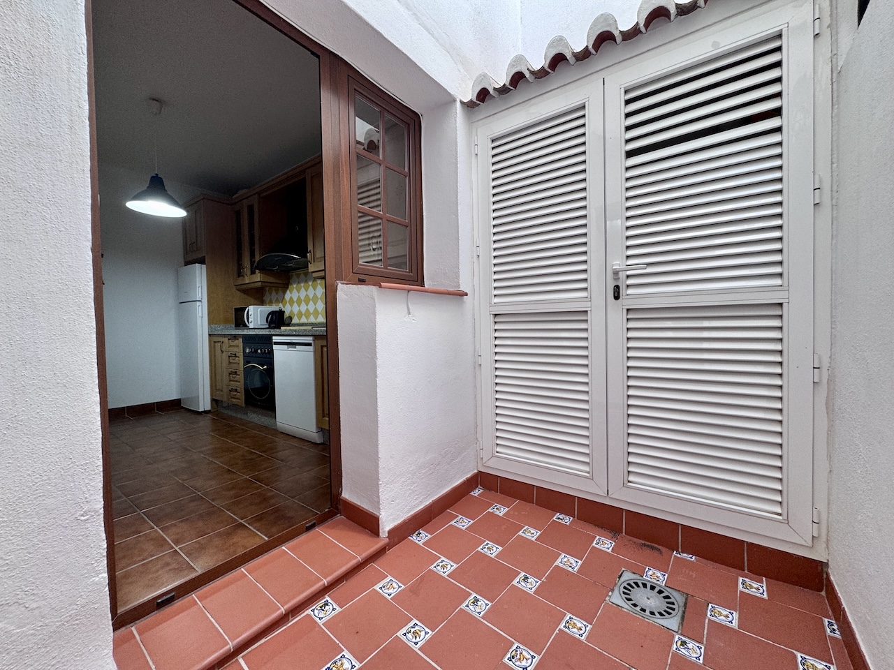 Utility patio with louvered doors