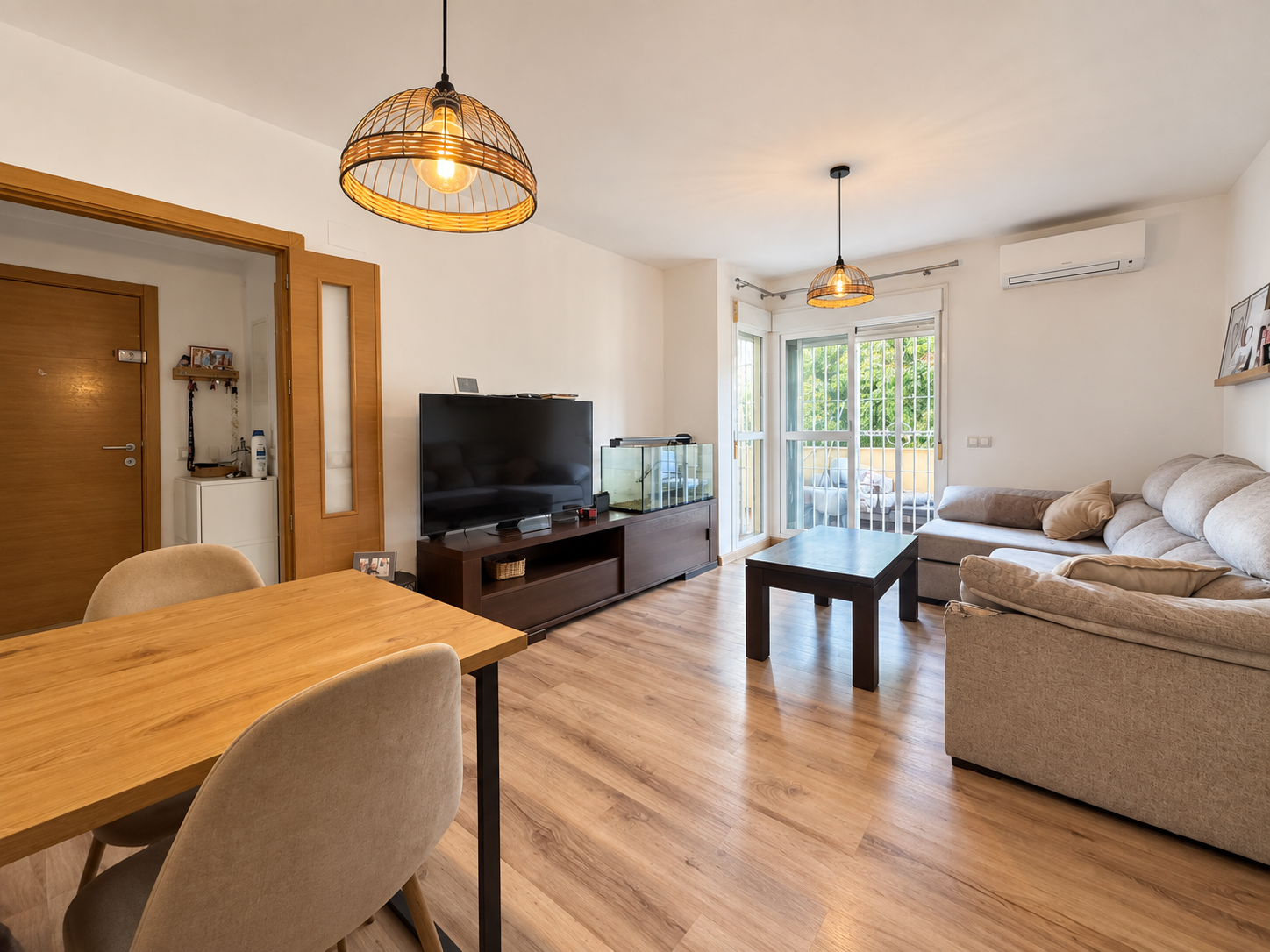 Living room with sofa, TV and terrace access