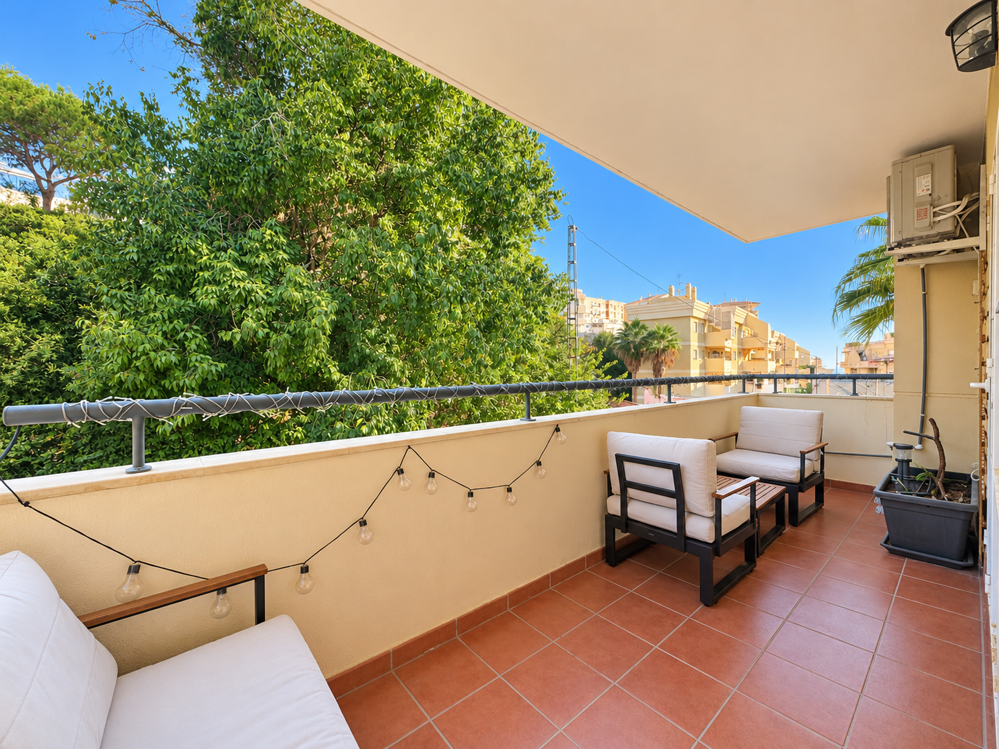 Terrace with side tables and views of greenery