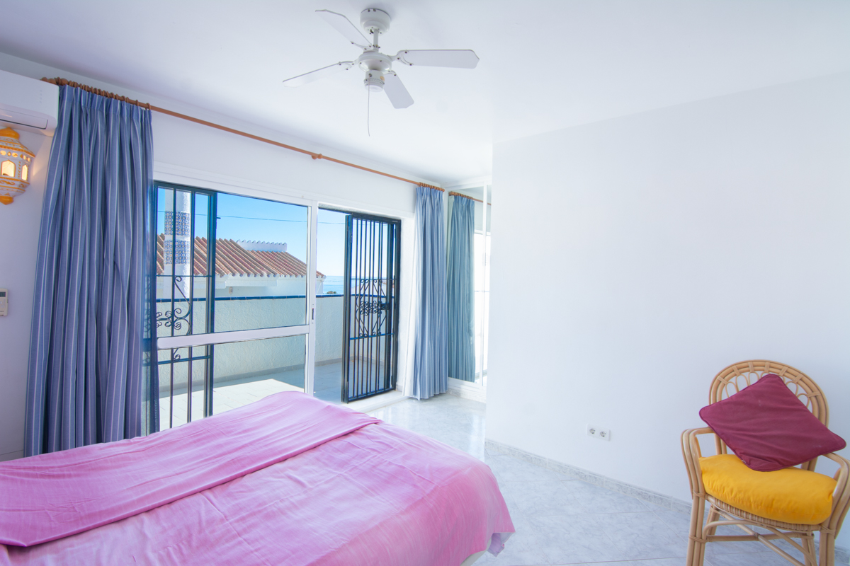 Bedroom with terrace access and sea views