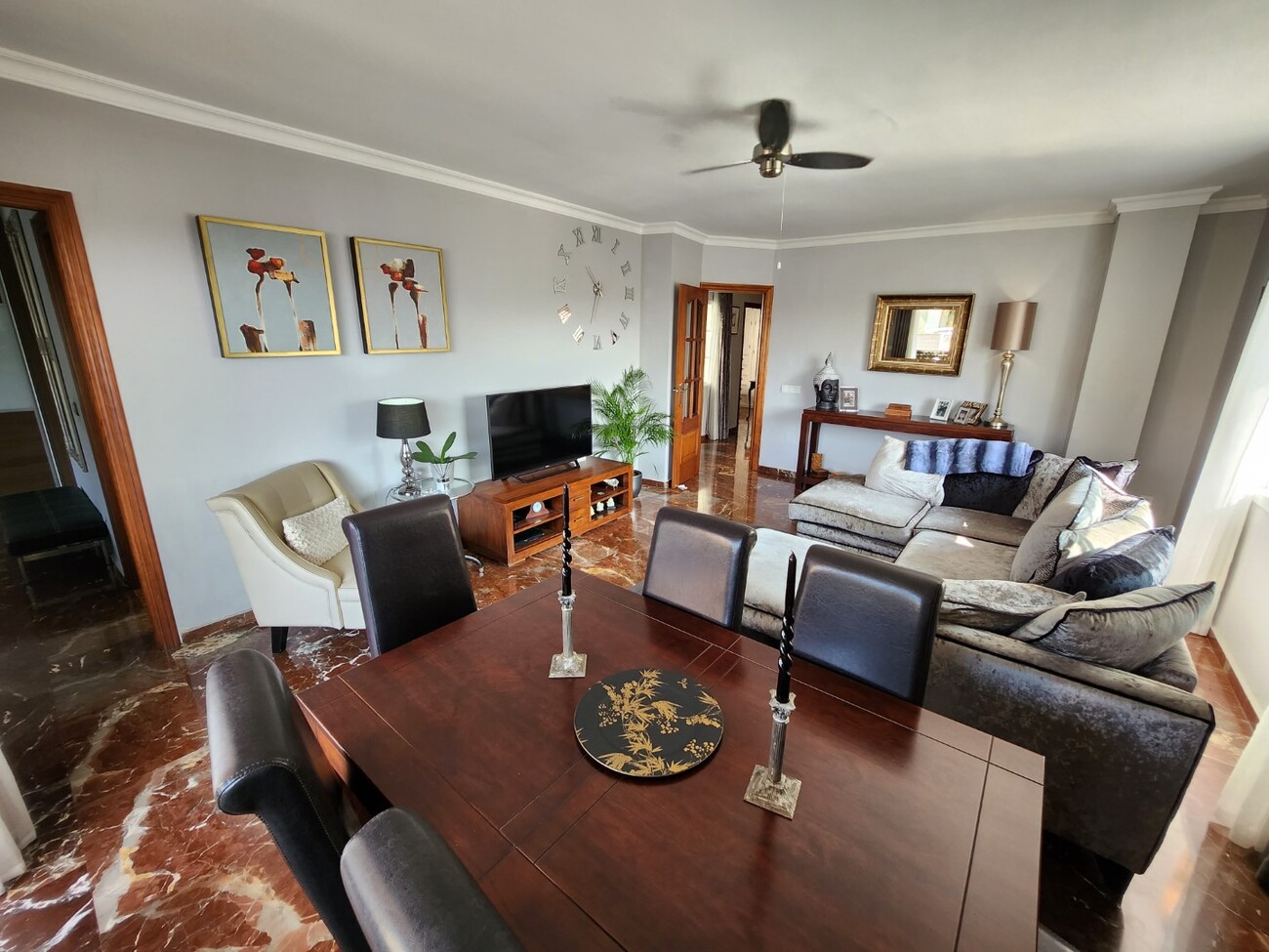 Living room with seating area and integrated dining space