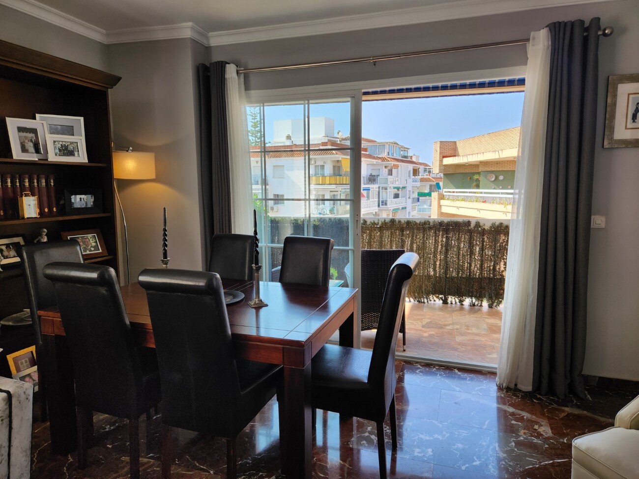 Dining room with six-seat table and terrace access