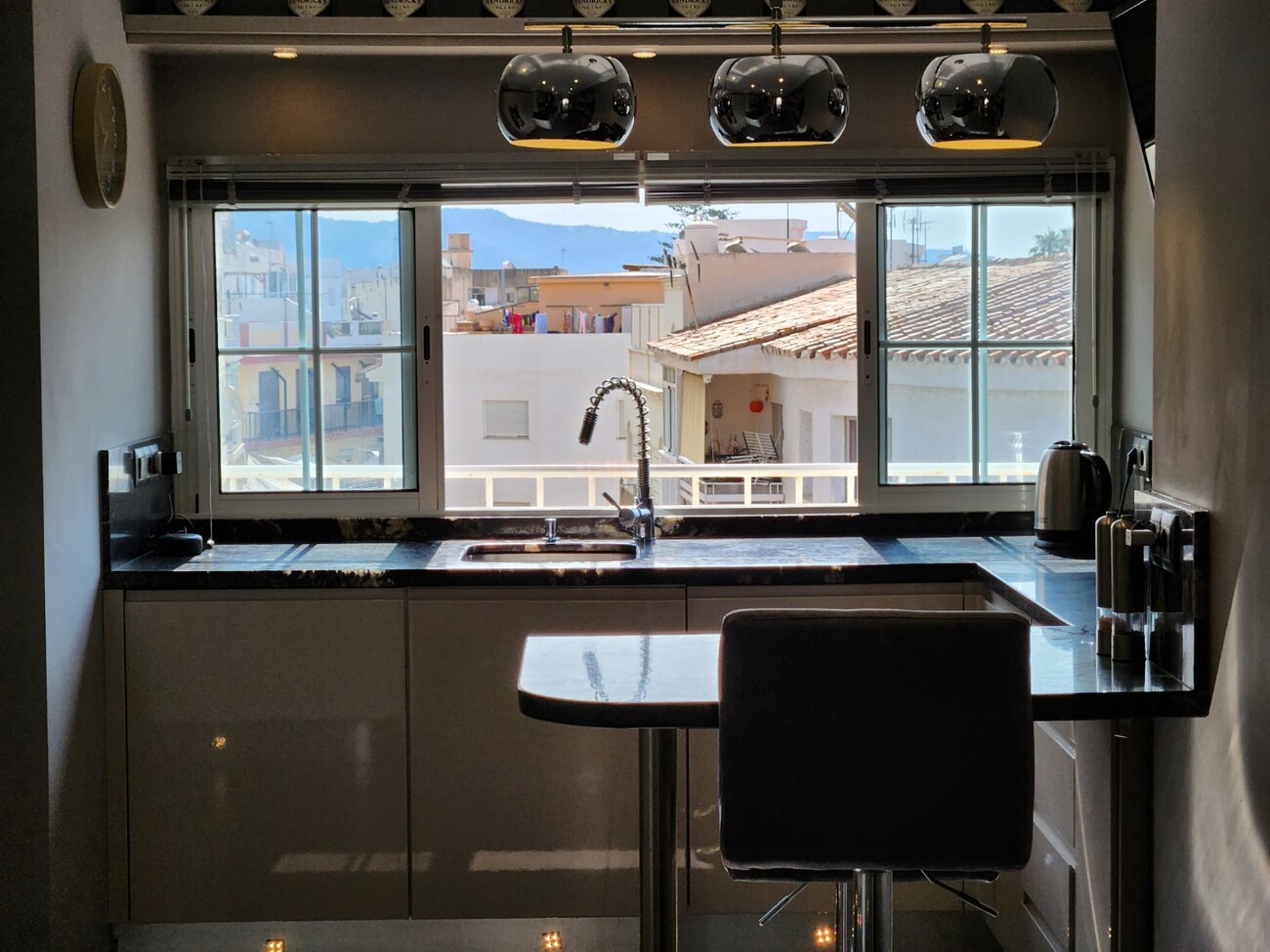Kitchen with large window and breakfast bar