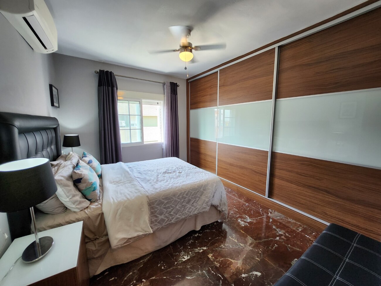 Bedroom with built-in wardrobe and double bed