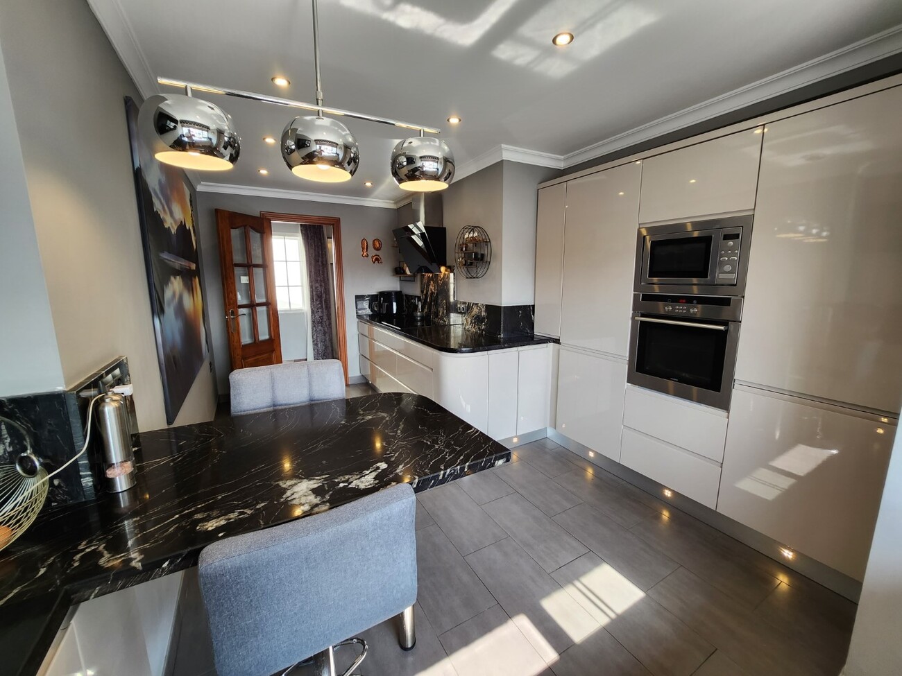 Modern kitchen with island and integrated appliances